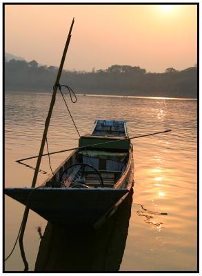 Common boat at sunset