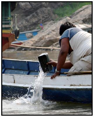 Bailing water on the Mekong