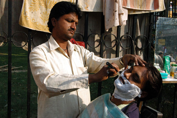 Man getting a shave, Old Delhi