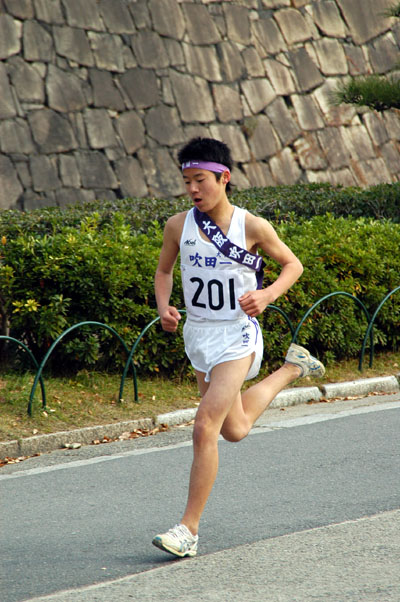 Japanese runner racing by Osaka Castle