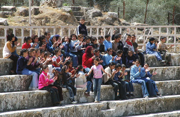 Jordanian school group singing at the North Theatre