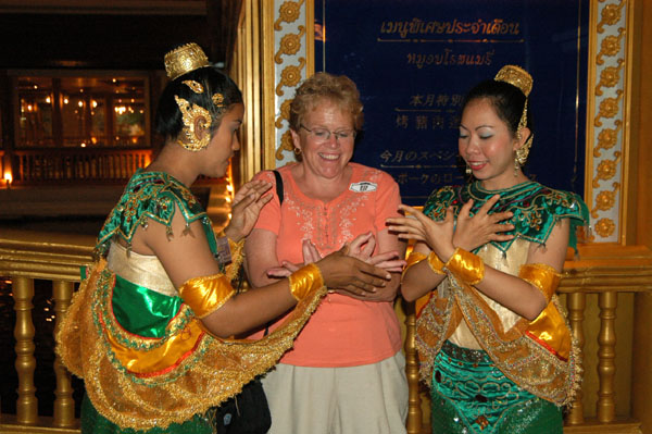 Thai girls trying to teach mom the hand positions