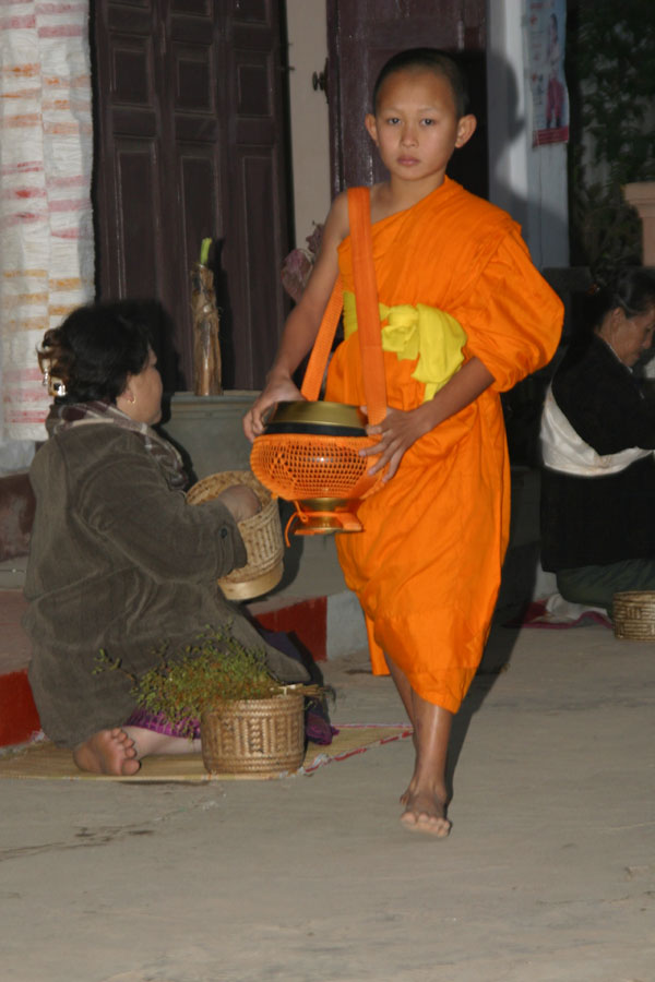 Young monk collecting