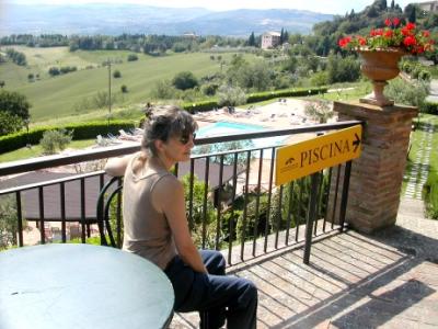 Judy near the pool of the Hotel Bramante with the Umbrian countryside in the background.