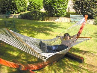 Judy relaxing on a hammock on the grounds of the Hotel Bramante