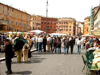 Piazza Navona: Baroque style-buildings from the 1600's-oblong racetrack in 1st c.-building foundations were for the grandstands