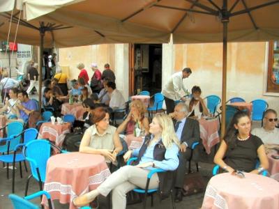 Judy (in rear) at Tre Scalini on Piazza Navona. We had their world famous tartufo chocolate gelato. Judy gave it a thumbs up!