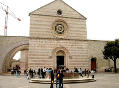 Basilica of St. Clare: (1260) - Gothic features, e.g., flying buttresses, on the left. She was a follower of St. Francis.
