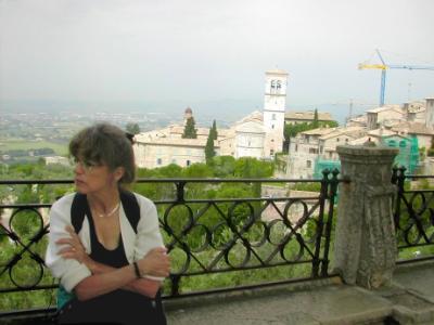 Judy - Assisi in the background. Cranes in town to repair damage from 1997 earthquake - 4 died at Basilica of St. Francis