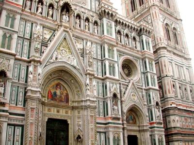 Left: Neo-Gothic marble facade of the Duomo - added in 1870's-1880's. Right: marble facade of the Campanile (bell tower).