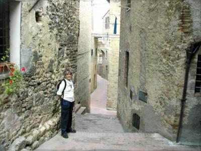 Judy on a passageway in San Gimignano