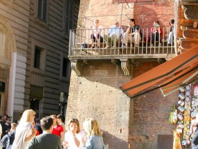 People-watching from a fire escape on Piazza del Campo