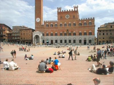 Piazza del Campo: From the 12th century. Background - Gothic Palazzo Publico (town hall) - completed in early 1300's.