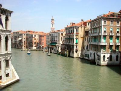 Grand Canal from the Rialto Bridge, looking north. Baroque tower (1600's) of the Church of the Santi Apostoli (6th c.) is seen.
