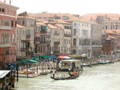 The Grand Canal from a bridge. The structure with a horizontal yellow band is a waterbus stop.
