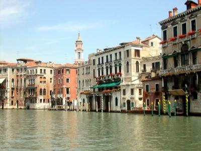 Grand Canal, looking north from a waterbus. Baroque tower (1600's) of the Church of the Santi Apostoli (6th c.) is seen.