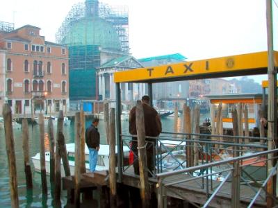 Water taxi (speedboat) at stand to take us to Marco Polo airport. In background: Church of San Simeon Piccolo (early 1700's).