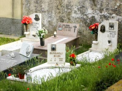 Graves - Lecchi cemetery: The dead are honored with flowers and photos. (Also lots of respect for older people in Italy.)