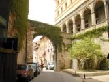 Medieval arch over a street in Assisi