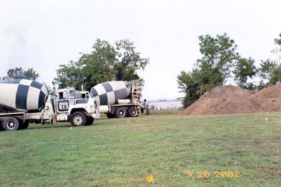 Finally!  The cement trucks to pour the footers