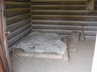 At Fort Boonesborough, they have set up three cabins to demonstrate the living conditions of the time.   This cabin shows how a person who had newly arrived would live. Dirt floor, no windows,  minimal furnishings.