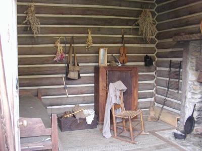 This cabin represents a later settler, who was able to bring more belongings on a wagon.  This one has a wooden floor,  and a window facing the inside of the fort.  There were no windows on the outside walls, except in the blockhouses.