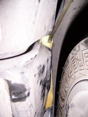 On the left side, I put the foam in from the bottom of the rear fender well and pushed it in with a long screwdriver