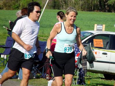 Jon handing baton off to Meg at 2nd exchange