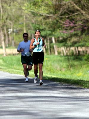 Meg running the 19th leg