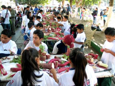 children carving radishes