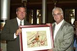 Gov. John G. Rowland accepting a photo of our state bird