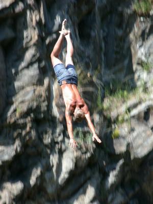 Diving into the Vltava from the rocks below Hotel Ruze