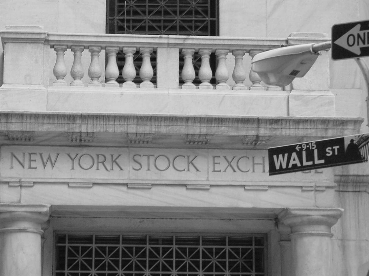 NYSE and Wall street sign.
