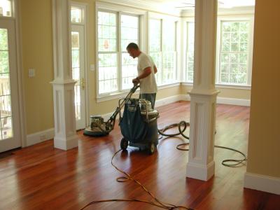 The floor receives a buffing between finish coats