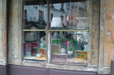A weathered shop window in the Marais section ( see the photographer in the reflection!)