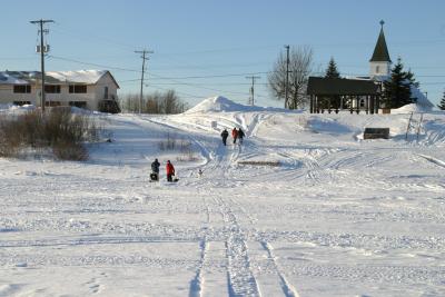 Up the bank of the Moose River between Moosonee Lodge and Anglican Church