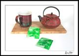Cast Japanese tea pot, handmade mug, bamboo board and green tea