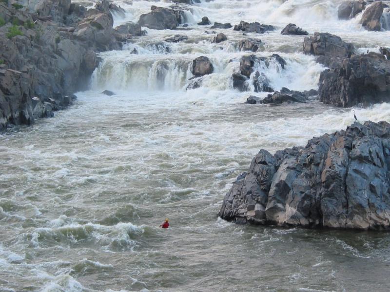Kayaker behind wave