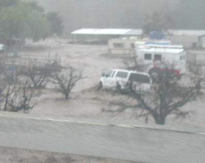 Vehicles flooded at Arnaz Grade