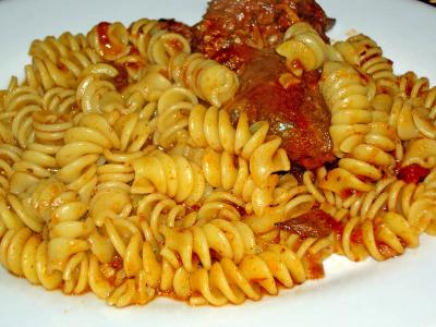 chili pot roast with sauce and rotini pasta