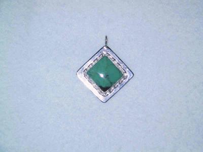 large (16 mm) square turquoise stone in a bezel setting on a hammered silver platform with a double twisted square wire frame. GONE