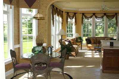 This is the view from the formal living room through the breakfast nook and into the family room, with the kitchen to the immediate right. You can make out the edge of the kitchen counter top to the right of the picture.