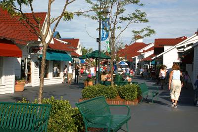 This is a typical street scene at Broadway, with shops lining the path. The property is divided into different themes, this being a New England fishing village. Retail outlets line each side.