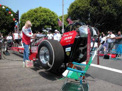 Jimmy Boyd firing up vintage dragster - - El Segundo Main Street Car Show