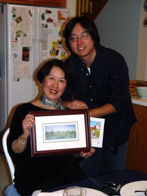 Esther and Edison Lin receiving a goodbye gift - a painting of Fredericton, 2004
