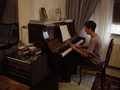 Aboud with his Piano .jpg