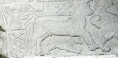 The little chariot scene placed above the large stone