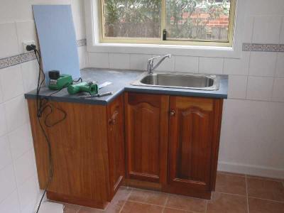 laundry trough installed, and wall color