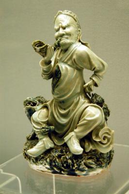 Underglaze blue statue of man blowing conch, Jingdezhen ware, Wanli Reign (1573-1620), Ming