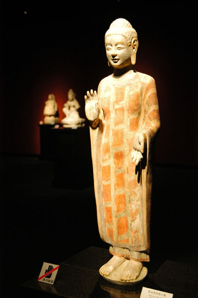 Standing Buddha, gold painted stone, Northern Qi (550-577 AD)